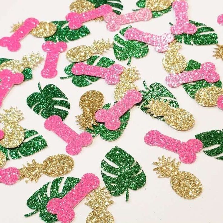 pink, green and gold glitter dog bone shaped confetti