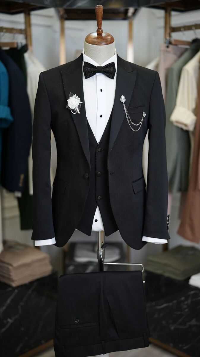 Look dapper on your next big event with this Handmade Black Prom Suit. This 3-piece suit is perfect for weddings, date nights, parties, and more! The shawl lapel style and double-vented jacket will make you stand out from the crowd. Personalize it by sharing your measurements. #Handmade #SuitUp #PartyWear #DateNight #Wedding #MensFashion #Dapper #VintageStyle #ClassicLook #MadeInIndia 🎩💼👔  #Wedding #Slim #Suit #Men #Handmade Prom Suits For Black Guys, Black Prom Suit, Pant Coat For Men, Suit Wedding Guest, Glitter Tuxedo, Black Suit Designs, Wedding Guest Suit, Black Prom Suits, Party Wear For Men