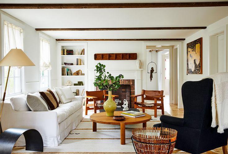 a living room filled with furniture and a fire place