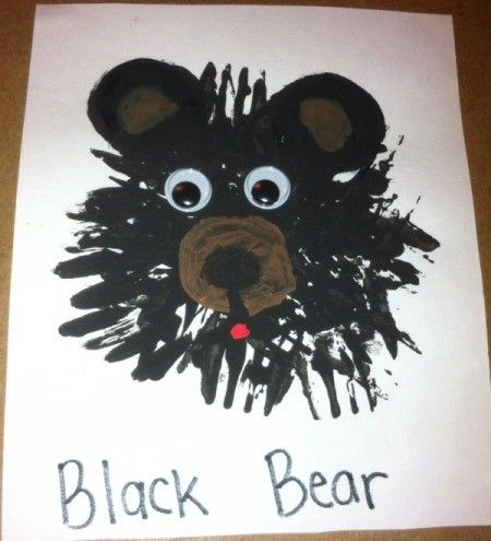 a black bear handprinted on white paper with the words black bear written in it