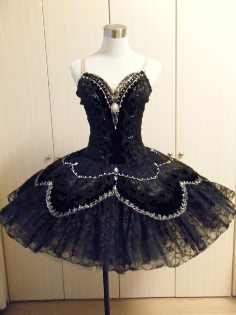 a mannequin is dressed up in a black tutu skirt with sequins