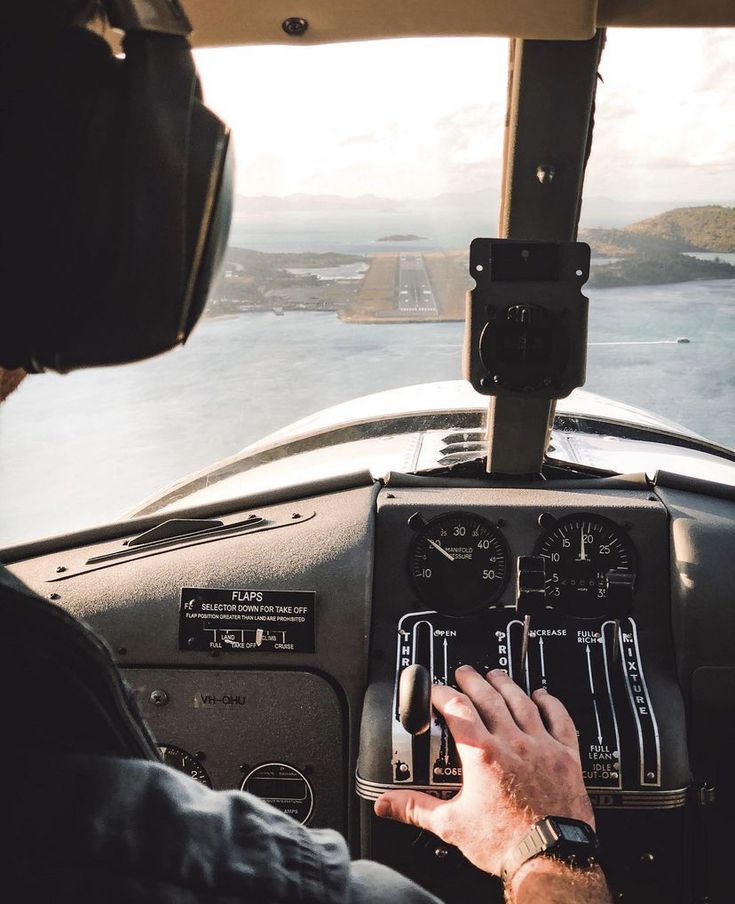 a man sitting in the cockpit of an airplane