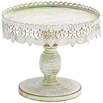 an ornate glass cake plate on a stand