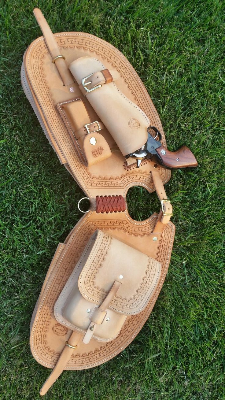 a pair of shoes that are laying on the ground in the grass with some tools inside them