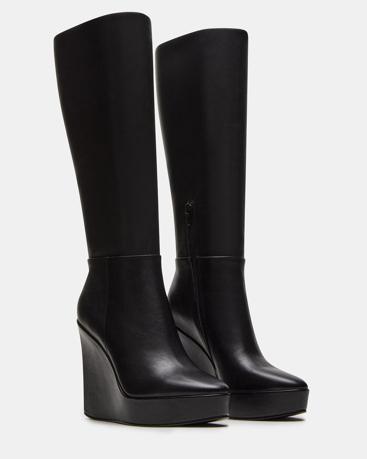 The AKIRA knee-high boot features a platform wedge design and a convenient inside zipper for easy on and off. Elevate your style game with this versatile and stylish boot, perfect for any occasion. 4.5 inch heel height Size 6 measurements: 14 inch shaft circumference, 13.75 inch shaft height Size 8 measurements: 15 inch shaft circumference, 14.75 inch shaft height Size 10 measurements: 16 inch shaft circumference, 15.75 inch shaft height Leather upper material Textile lining Synthetic sock Synth Leather Knee High Boots Outfit, Winter Wedges, Knee High Wedge Boots, Black Wedge Boots, Knee High Platform Boots, Platform Boots Women, Summer Wardrobe Staples, Wardrobe Capsule, High Leather Boots