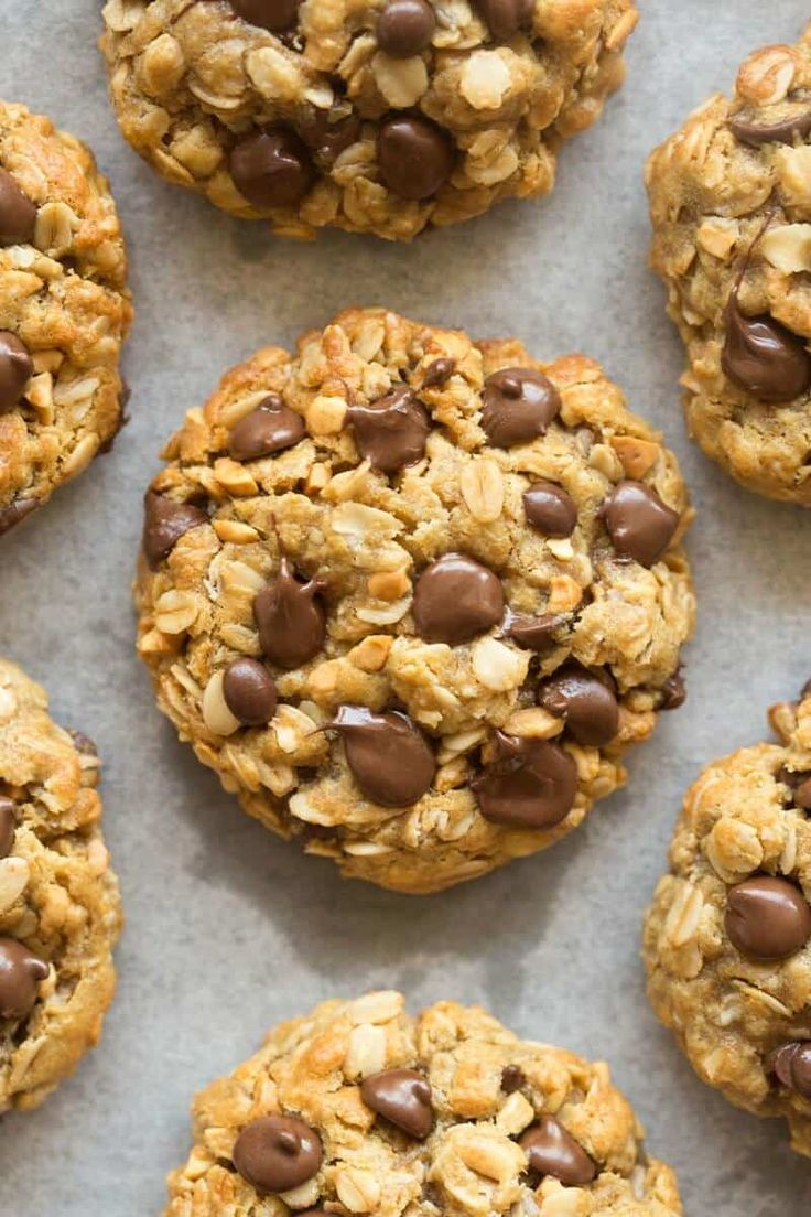 cookies with chocolate chips and oats on a baking sheet