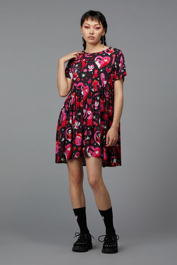 Embrace your inner diva with the Devil Dance Party Dress by Black Friday. This print dress features a round neckline and short sleeves, providing a classic silhouette that flatters all body types. The fitted style bodice accentuates the waist, while the flared skirt offers a fun and flirty vibe. The gathered waist adds volume to the skirt, enhancing the relaxed fit for ultimate comfort and style. Made from soft woven viscose, this dress is both lightweight and breathable, making it ideal for war Dance Party Dress, Kids Scrubs, Party Dress Sale, Raincoat Kids, 1940s Fashion, 1960s Fashion, Halloween Fashion, Dress 16, Dance Party