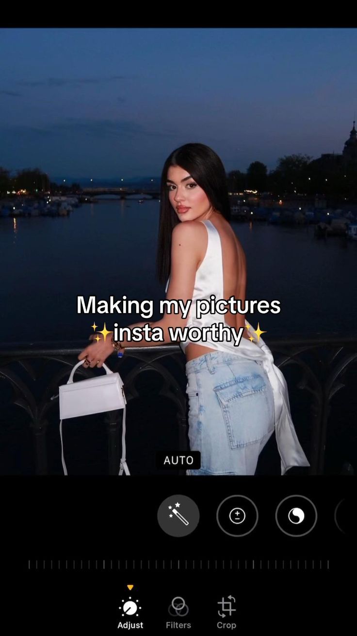 a woman in white shirt and jeans standing next to a railing with the caption making my pictures insta worthy