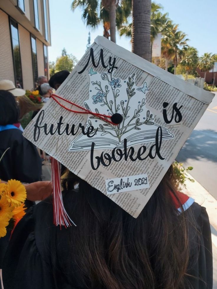 a graduate's cap that reads, my future is booked