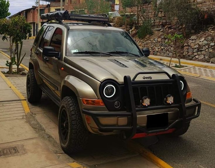 a jeep is parked on the side of the road