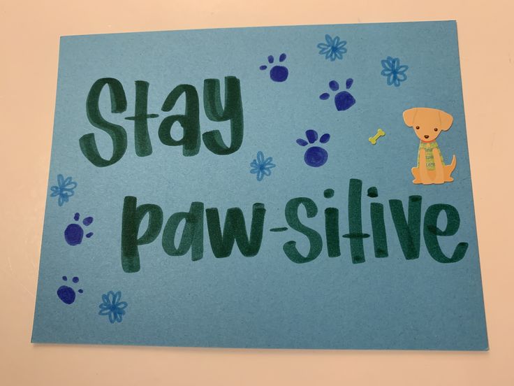 a handmade sign that says stay paw - slive with a dog and paw prints