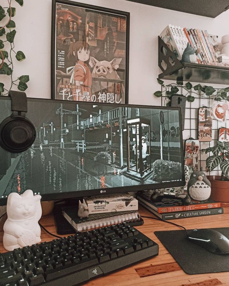 a computer monitor sitting on top of a wooden desk next to a keyboard and mouse