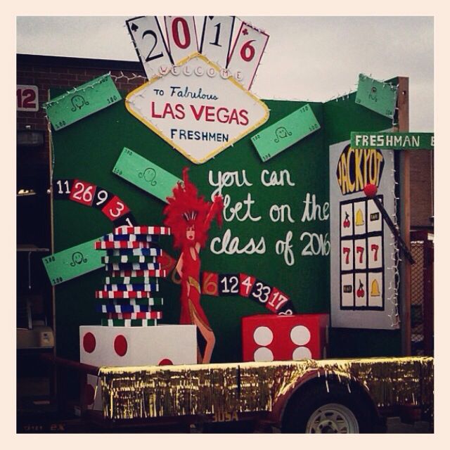 a large sign that is on the back of a truck in front of a building