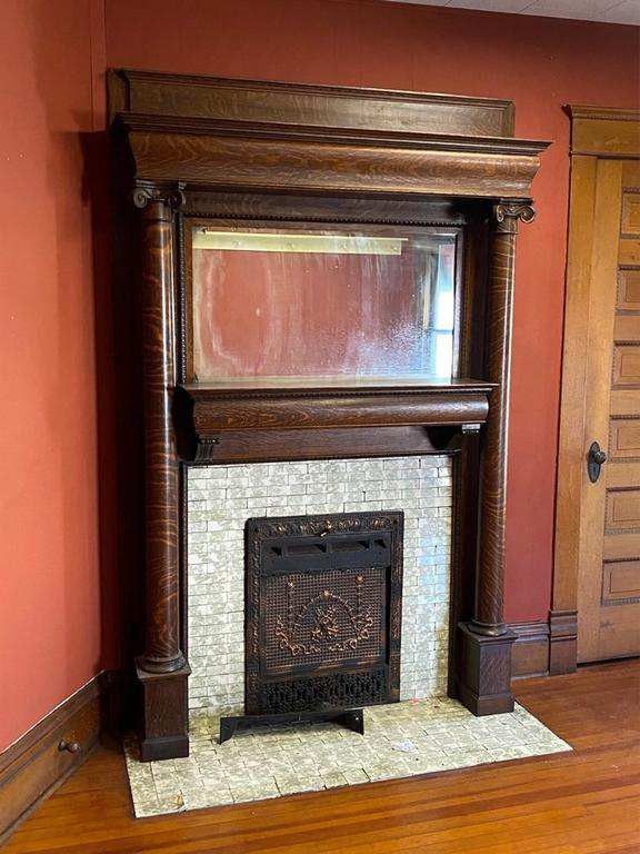 an old fireplace in the corner of a room