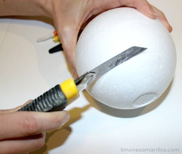 a person is cutting into an egg with a pair of scissor blades on it