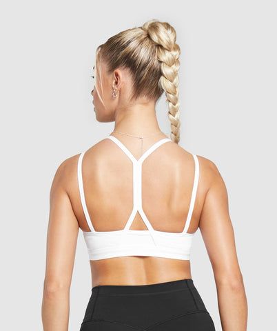 IT’S NOT YOU, IT’S YOUR SPORTS BRA With lightweight, breathable designs, comfortable cups and supportive straps, you can rely on our sports bras to be there for you, and for yours. • Cute double strap feature• Removable padding lets you to wear it how you want• Light V-neck• Stay-put elasticated underband SIZE & FIT• Medium support• Body fit• Model is 5’8” and wears a size XS MATERIALS & CARE• 78% Recycled Polyester, 22% Elastane SKU: B8A6A-WB57 Stretch Sports Bra With Straps, Supportive Strapped Sporty Activewear, Supportive Strappy Sporty Activewear, High Stretch Activewear With Adjustable Straps For Sports, Medium Support Activewear With Straps For Sports, Sports Activewear With Medium Support Straps, Supportive Straps Sports Activewear, Sporty High Stretch Activewear With Straps, Sporty Nylon Activewear With Straps