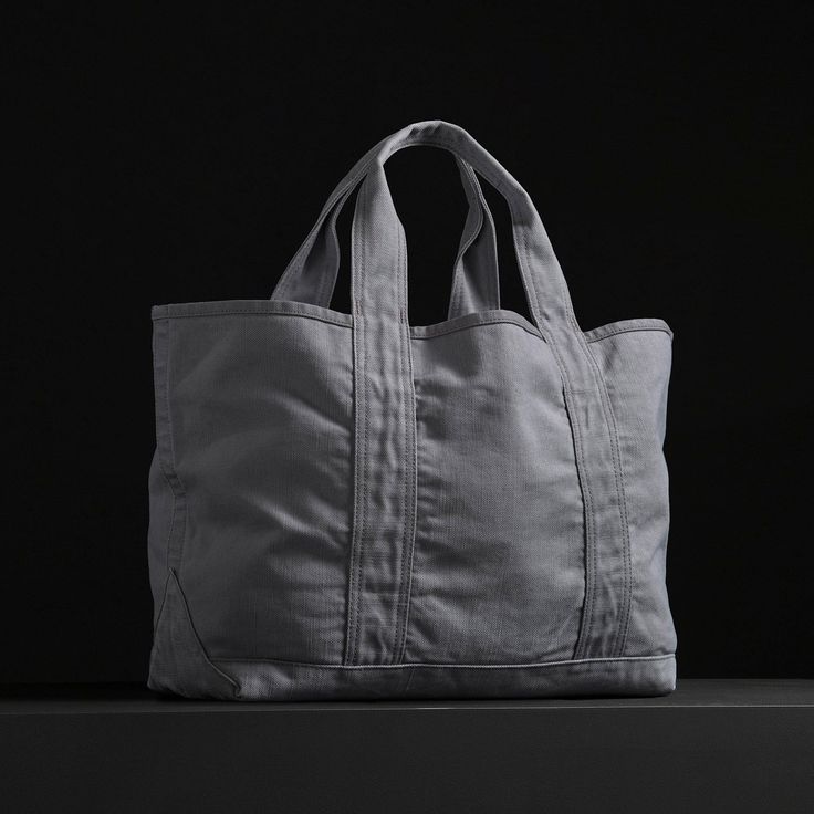 The perfect carry all tote bag with an inside pocket and comfortable shoulder straps. This bag is constructed from thick, durable canvas that is ideal for everyday use.Additional Information:• 40% Cotton, 40% Linen, 20% Polyurethane. • Imported• Width: 24 in. Height: 13 in. • Inside Pocket Width: 10 3/4 in. Height: 8 1/2 in. • Shoulder Strap Drop: 8 in. • Spot clean. Everyday Canvas Tote Bag With Reinforced Handles, Canvas Tote Shoulder Bag With Reinforced Handles, Functional Canvas Tote Shoulder Bag, Modern Cotton Shoulder Bag With Pockets, Functional Canvas Tote Bag With Top Handle, Functional Canvas Tote Bag With Top Carry Handle, Practical Canvas Tote Bag With Reinforced Handles, Functional Cotton Shopping Bags, Functional Double Handle Canvas Shopping Bag