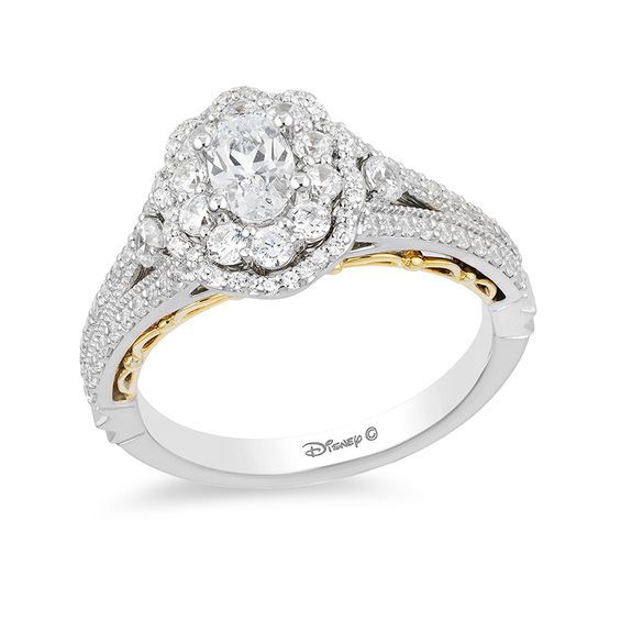 a white and yellow gold engagement ring with diamonds on the band, set in two tone gold