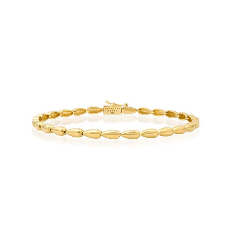 The Small Dome Tennis Bracelet is crafted in polished 18 karat gold and exudes timeless, vintage inspired appeal to create a sophisticated wear-forever look. Whether worn alone, or stacked with other bracelets, this tennis bracelet instantly elevates any look. It's the perfect foundation for your jewelry wardrobe - instantly adding a dose of quiet luxury with minimalist elegance. Bracelet measures 6.5 inches in length Push Clasp Fastening with Safety Made with love in Los Angeles Complimentary g Timeless Gold Jubilee Bracelet, Timeless Yellow Gold Tennis Bracelet, Classic Yellow Gold Bangle With Oyster Detail, Timeless Diamond Bracelet With Polished Finish, Classic Yellow Gold Diamond Bangle Bracelet, Classic White Gold Diamond Bracelet With Oyster Clasp, Timeless 14k Gold Tennis Bracelet, Classic White Gold Diamond Oyster Bracelet, Classic 14k Gold Jubilee Bracelet