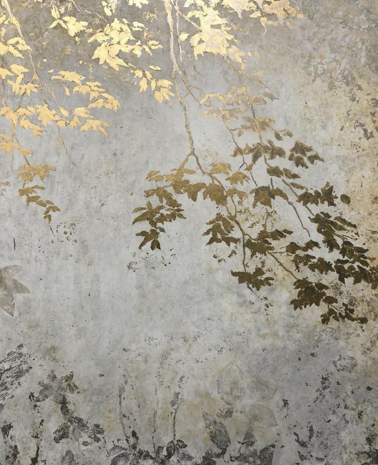 an artistic painting with gold leaves on the wall