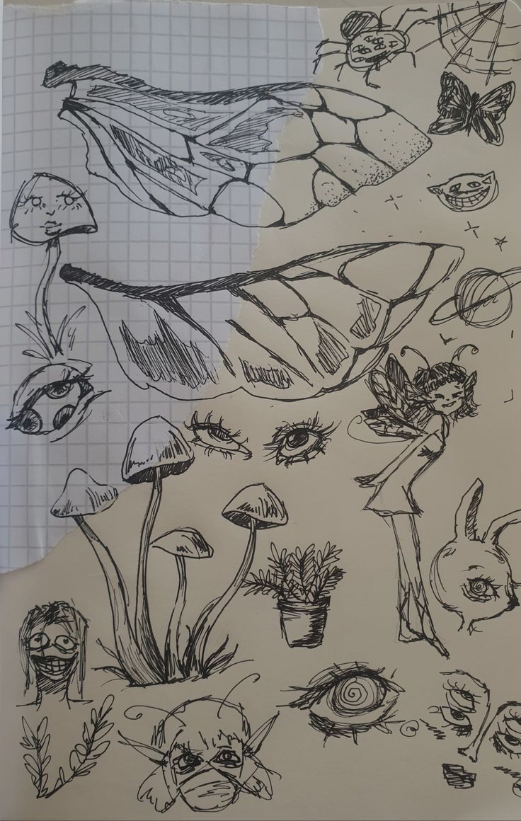 some drawings are on top of a piece of paper