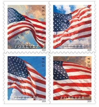 four postage stamps with the american flag flying in front of blue sky and white clouds