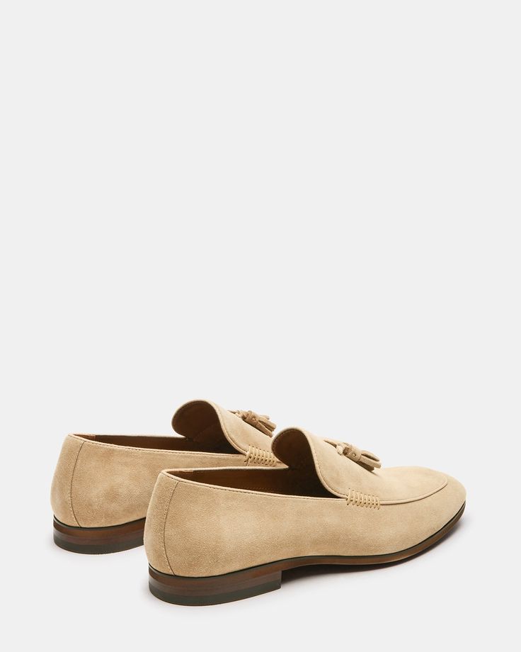 Expertly crafted with a slip-on construction and almond toe, the ONDRE loafer showcases a sleek and sophisticated design. The tassel accent across the vamp adds a touch of elegance, making it the perfect addition to any formal or business casual outfit. .75 inch heel height Suede upper material Textile and synthetic lining Textile and synthetic sock Rubber sole Imported Modern Slip-on Tassel Loafers With Brogue Detailing, Business Slip-on Loafers With Tassels, Modern Tassel Loafers With Brogue Detailing, Formal Slip-on Oxfords With Tassels, Classic Suede Tassel Loafers For Formal Occasions, Business Casual Tassel Loafers With Brogue Detailing, Modern Suede Slip-ons For Formal Occasions, Office Slip-on Loafers With Tassels, Elegant Suede Tassel Loafers With Brogue Detailing