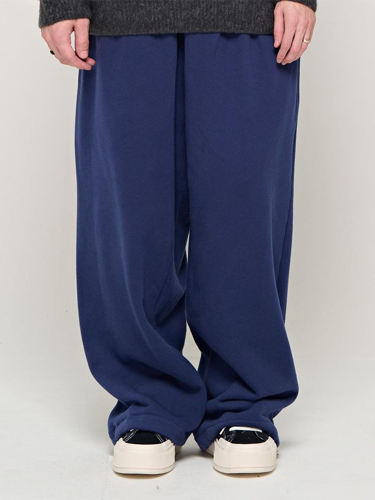 Composition : COTTON 100%Country of Origin : KOREA Navy Cotton Trousers, Navy Wide Leg Cotton Pants, Navy Bottoms For Streetwear, Blue Full Length Sweatpants With Pockets, Navy Pants With Side Pockets For Streetwear, Classic Indigo Bottoms With Pockets, Navy Sporty Relaxed Fit Bottoms, Navy Casual Baggy Bottoms, Casual Navy Baggy Bottoms