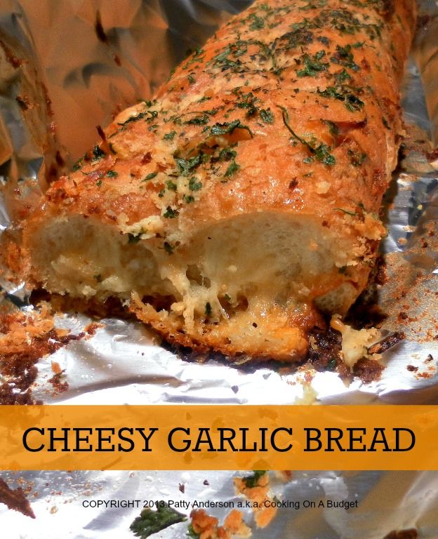 cheesy garlic bread on foil with text overlay