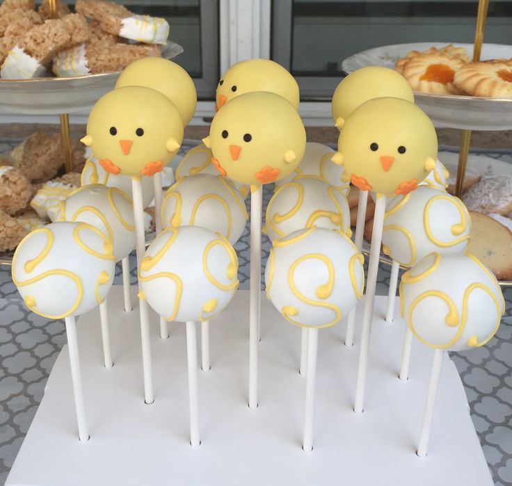 cake pops with yellow frosting decorated as chicks