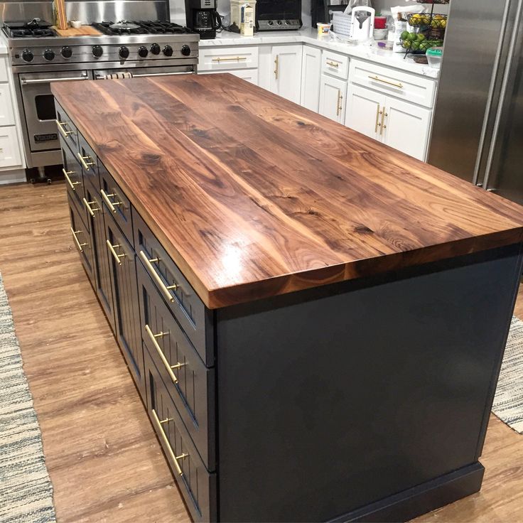 a kitchen island made out of wood and metal