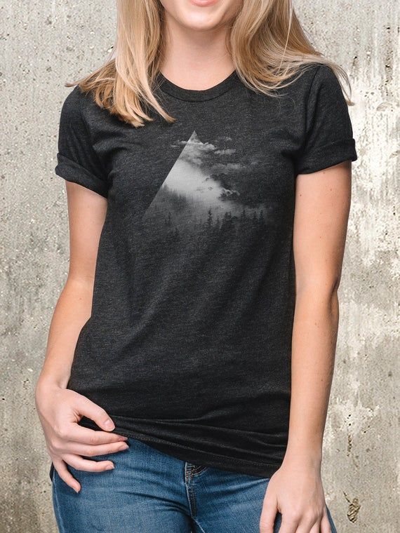 This women's tee features a cloudy  mountain landscape that is fading out into the clouds across the front of the nature themed tee. This is a comfortable, easy care t-shirt that you'll feel great wearing all day for both outdoor and indoor leisure activities.Our high quality women's tees also make great birthday gifts and Mother's Day gifts for friends and family who love nature and the outdoors.Light Grey Ink on our Women's Blended Fabric T-Shirt | Heather Charcoal | - 52% combed and ring-spun Mountain Tee Shirt, Mountain Graphic Tee, Alpine Design, Black Lantern, Hiking Tshirt, Mountain Tshirt, Mountain Shirt, Estes Park, Simple Tshirt