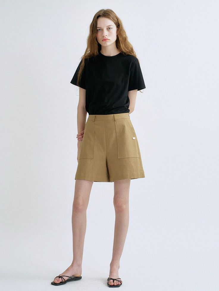 This is a trendy and feminine pants by ANEDIT that is made out of high quality and sturdy material. With distinctive mood of the design and modern feminine look, you can style it for your comfortable daily outfit.- Feminine mood and soft touch- High waistline and A line silhouette- Fake pocket and ox horn buttons detail Modern Beige Pants, High-waisted Khaki Shorts For Work, Chic Khaki Bottoms With Side Pockets, Chic Khaki Cotton Bottoms, Khaki Workwear Shorts With Side Pockets, Modern Beige Bottoms With Pockets, Chic Relaxed Fit Khaki Bottoms, Versatile Khaki Bottoms For Workwear, Feminine Pants