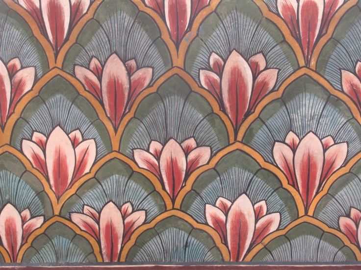 an art deco wallpaper with pink flowers on it