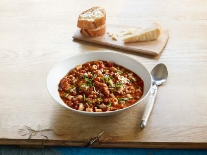 a bowl of chili with bread on the side