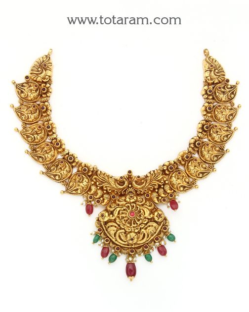 22 karat gold "mango - peacock" necklace with pearls & beads (temple jewellery)

  exquisite 22 karat gold "mango - peacock" necklace  indulge in the timeless beauty of this stunning 22 karat gold "mango - peacock" necklace from totaram jewelers. handcrafted in india, this temple jewelry piece is a true masterpiece that exudes elegance and sophistication. the intricate design showcases a perfect blend of traditional motifs like mango and peacock adorned with lustrous pearls and b Luxury Gold Temple Necklace With Peacock Design, 22k Gold Necklace, Temple Jewelry Necklace, Necklace With Pearls, Gold Temple Jewellery, Peacock Necklace, Beads Making, Temple Jewelry, Traditional Motifs