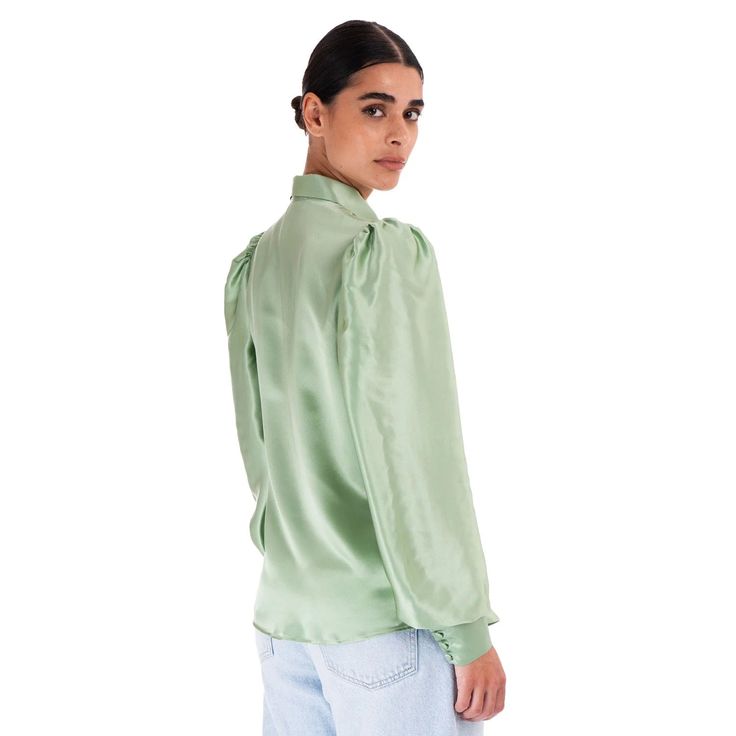 A classic shirt handcrafted in luxurious pure silk in soft green tones with feminine and elegant tailoring. Embellished with mother of pearl buttons, classic collar and a soft fit. The perfect choice with our suits and skirts from the same collection. Handmade to order made to measure in Italy Fabric: 100 % Satin Silk Hidden opening center front with mother of pearl buttons Softly fitted Long sleeves with three hand-covered silk buttons Treatment: Dry clean only The model is 174 cm tall and wears size EU 36 Shirt Blouses Women's, Unique Outfit, Satin Blouses, Gifts For New Mums, Pearl Jewellery Earrings, Green Tones, Satin Silk, Italian Fabric, Green Blouse