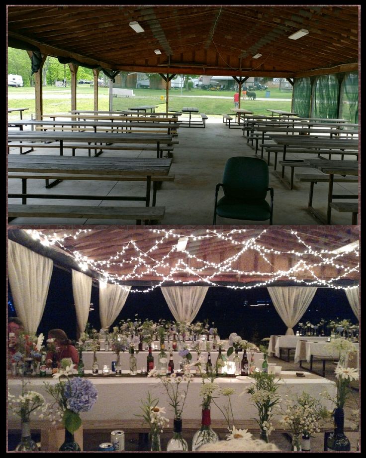 the tables are set up for an outdoor wedding with lights strung from them and flowers in vases