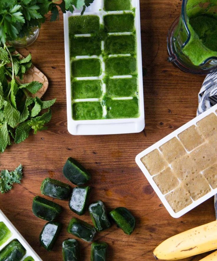 the ingredients to make this green smoothie are displayed on a wooden table