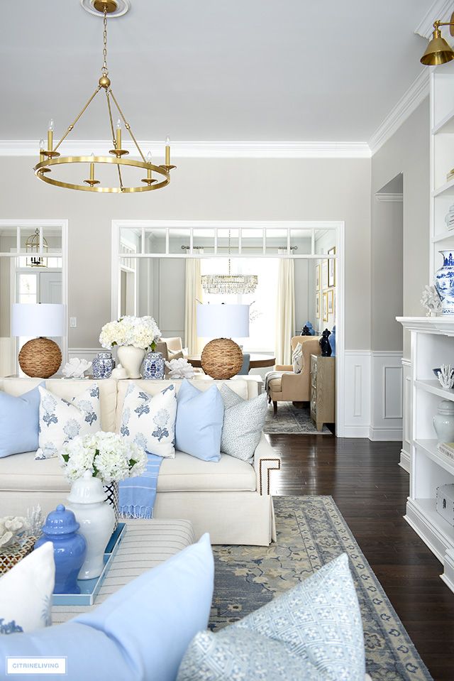 the living room is clean and ready for guests to come home with their family members