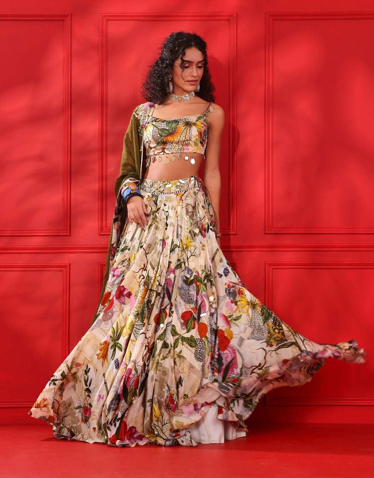 Editor's Note Elevate your fashion quotient with this printed cowl blouse-lehenga set, a harmonious fusion of modern design and timeless charm, guaranteed to turn heads at any event. Fabric: Satin organza, shantoon and organza Color: Multicolor Components: Lehenga, blouse and dupatta Occasion: Engagement and festive Note: Product colour may slightly vary due to photographic lighting sources Care: Dry clean only About the Designer Mahima Mahajan has injected a breath of fresh air into the Indian Cowl Blouse, Mahima Mahajan, Mirror Detail, Blouse Lehenga, Mehendi Outfit, Bride Sign, Blouse Yoke, Printed Lehenga, Mehendi Outfits