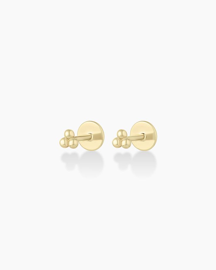 This pair of solid gold flatback earrings is crafted from solid gold, making it a timeless and luxurious addition to any jewelry collection. Perfect for stacking or to wear alone, these gold earrings provide long-lasting shine. The flat back allows for comfortable, 24/7 wear. Wear yours stacked with other diamond huggie hoop earrings and studs. Trio Flat Back Studs Earring in 14k Solid Gold, Women's by gorjana Earrings Stacking, Flat Back Earrings, Tiny Earrings, Tiny Stud Earrings, 14k Gold Necklace, Mix Style, Gold Necklaces, Gold Threads, Huggie Hoop Earrings