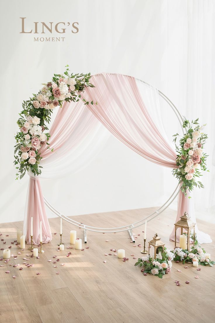 a wedding arch decorated with flowers and candles