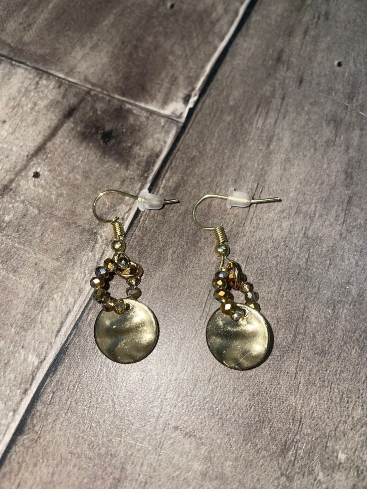 Hammered gold charm with gold iridescent gem beads in a hoop Gem Beads, Cedar Rapids, Hammered Gold, Gold Charm, Jewelry Earrings Dangle, Dangle Drop Earrings, Dangle Earrings, Jewelry Earrings, Gems