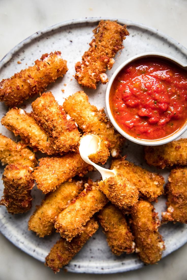 fried food on a plate with dipping sauce