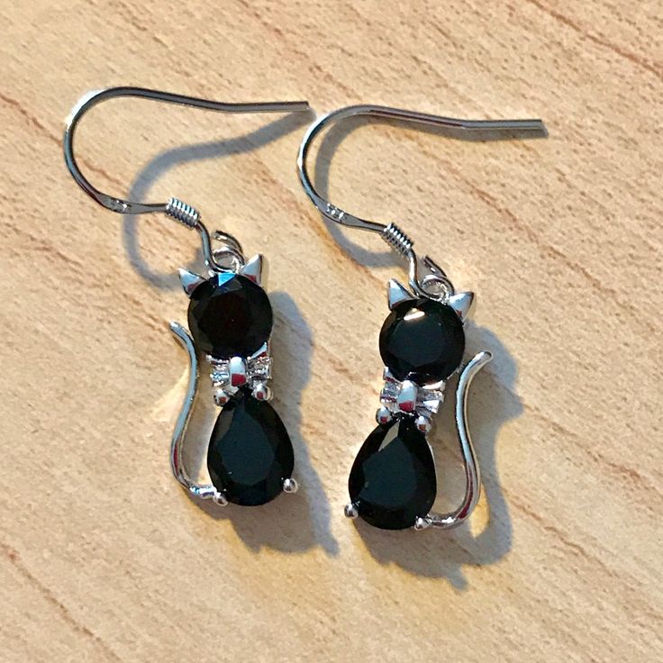 Adorable Halloween Black Cat Dangle Earrings Sterling Silver Earrings. Measure 5/8" In Height. Makes A Great Gift Or Just For Yourself!!! Comes With A Gift Box. Black Cat Ears Earrings For Halloween, Black Hypoallergenic Halloween Earrings, Black Halloween Jewelry With Cat Ears, Black Hypoallergenic Earrings For Halloween, Black Cat Design Earrings For Halloween, Black Cat Design Drop Earrings, Halloween Black Cat Design Jewelry, Black Cat Ears Earrings For Party, Black Cat Ears Jewelry With Cat Design