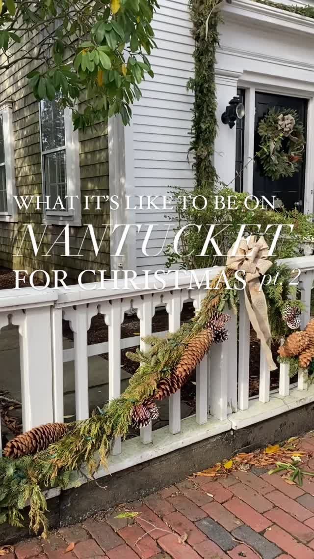 the front porch is decorated for christmas with pine cones and greenery