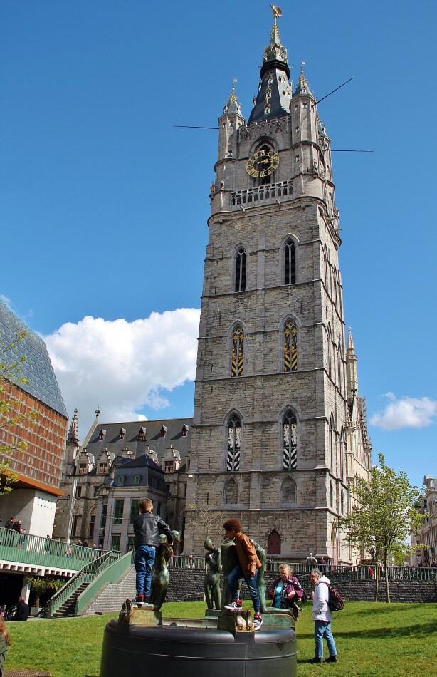 people are standing in front of a tall tower