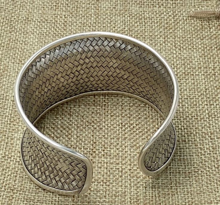 "Braided Sterling Silver Statement Boho Cuff Bracelet, Handmade Wide Woven white Silver Ethnic Bangle, Tribal Weave Adjustable Cuff Width: Front side 1 9/16 inches (1.6\") / 4cm Longer versions (2.75\" and 4.3\"): https://www.etsy.com/listing/603575462 https://www.etsy.com/listing/569455658 Metal Purity: 95% Silver (Purer than 925 Sterling Silver) We also have designs version of Braided cuff : https://www.etsy.com/listing/253985429/wide-woven-silver-cuff-bracelet-extra?ref=shop_home_active_24 An Traditional Woven Bangle Bracelet, Traditional Woven Bracelet Jewelry, Traditional Woven Bangle Jewelry, Traditional Woven Bangle, Traditional Woven Bracelet, Adjustable Handwoven Traditional Cuff Bracelet, Traditional Handwoven Adjustable Cuff Bracelet, Traditional Silver Hand-wrapped Bracelets, Adjustable Cuff Bangle In Traditional Style