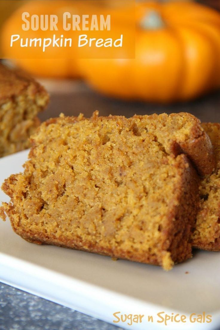 two pieces of pumpkin bread on a white plate